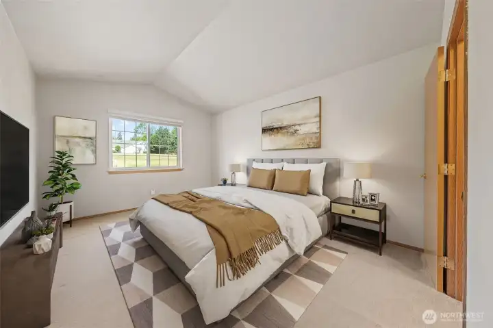 Vaulted ceilings add a touch of elegance to the primary bedroom. Virtually staged. Vaulted ceilings add a touch of elegance to the primary bedroom. Virtually staged.