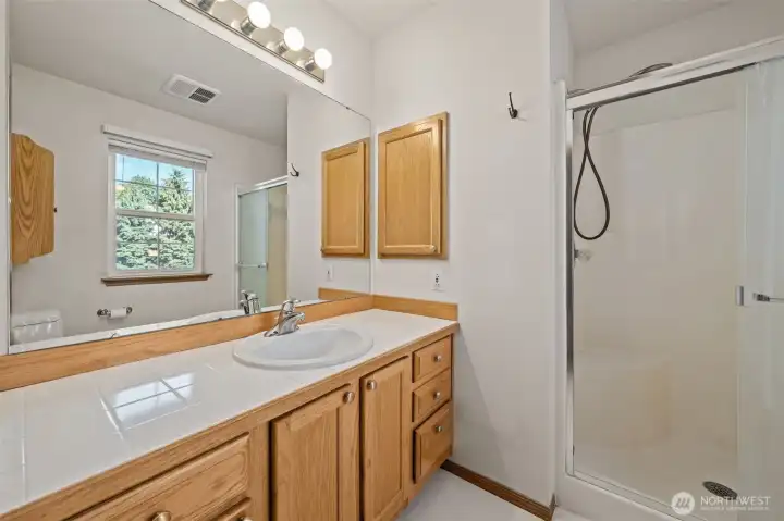 3/4 primary bath with extra long counter space. 3/4 primary bath with extra long counter space.