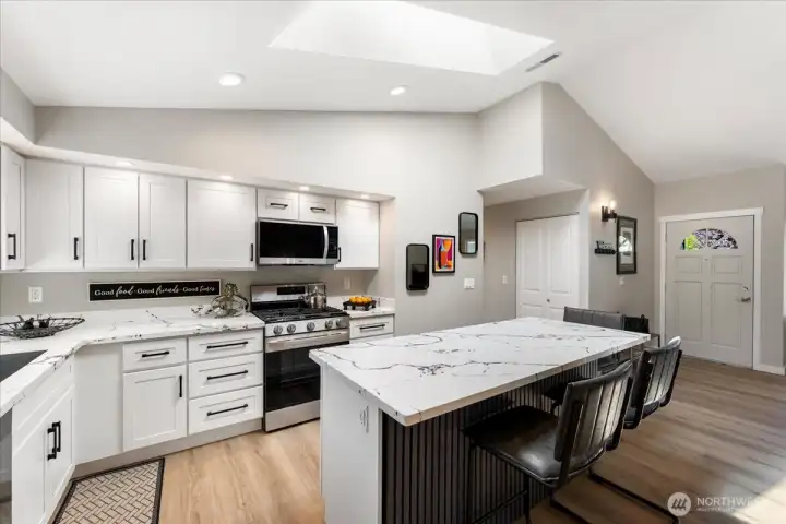 Skylight fills the kitchen with abundant natural light. Plenty of cabinetry and generous prep space make cooking a pleasure. Skylight fills the kitchen with abundant natural light. Plenty of cabinetry and generous prep space make cooking a pleasure.