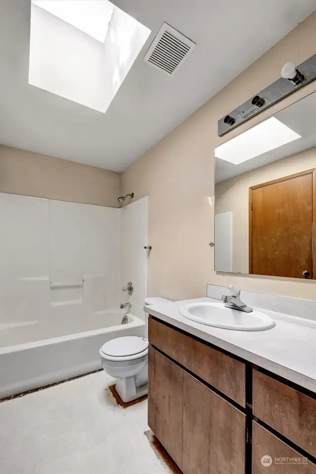 Continental bath off Primary Bdrm, opens to hall and bedroom.