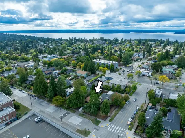 Aerial view on home on the corner, EC Hughes Parking in lower left, Puget Sound, Vashon Island .in the distance