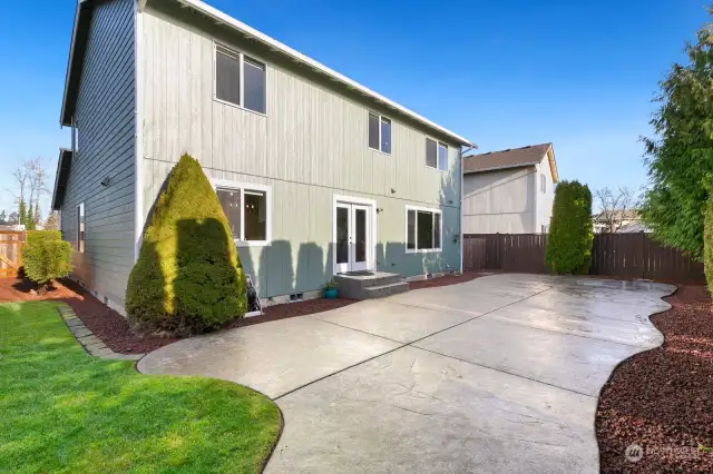 Backyard has large patio, fire pit & shed