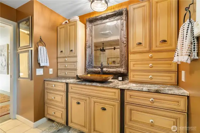 2nd bathroom with tons of custom cabinets and tile floors