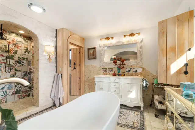 Primary bathroom with central free standing soaking tub