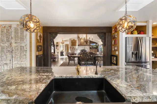 View from your kitchen sink to the dining room and family room area.