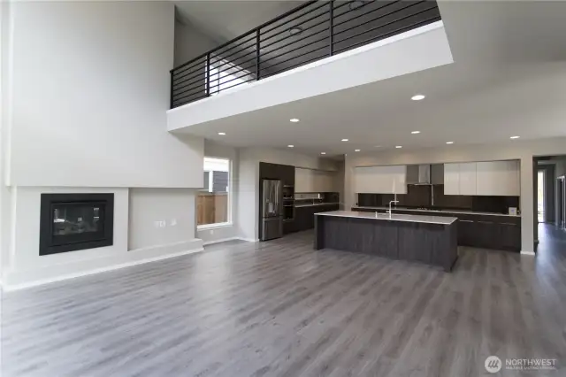 Open concept living spaces throughout: Loft with custom-made railing is a stunning addition to the Soaring Great Room