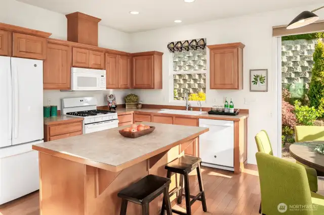 Eat-in kitchen with space to sit at the kitchen island.
