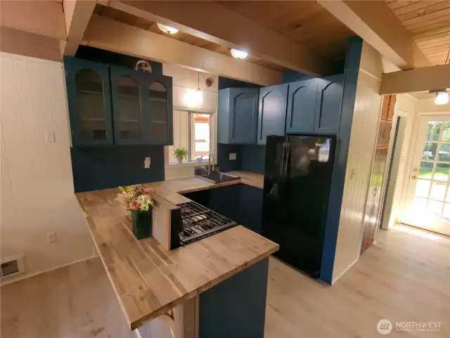 Kitchen leads to Sweet Back Yard