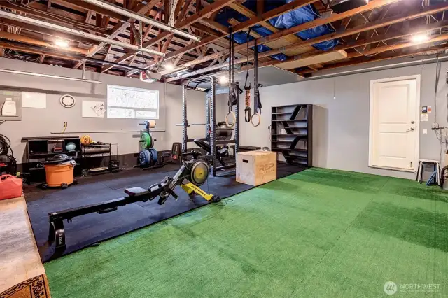 Garage currently used as gym. The weight area can stay with home if new owners desire