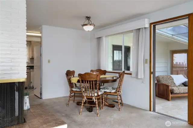 dining room, sun room and corner of the gas fireplace