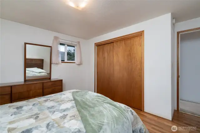 Primary closet and door to the hallway