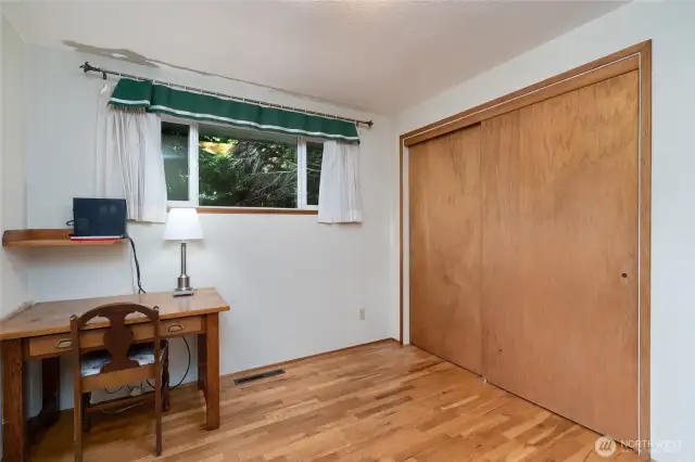nice sized closet and hardwood floors.  you could trim the tree for more natural light.