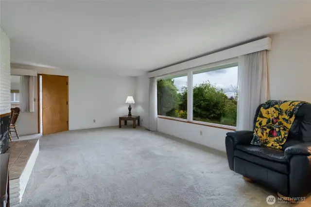 spacious living room, on nice days, you can see Mt. Baker, and on rainy days, you can light the gas fireplace.