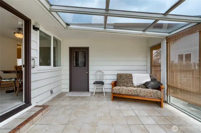 From the other angle, the door is access to the garage, and can be opened up for a cross breeze in the summer for the perfect temperature