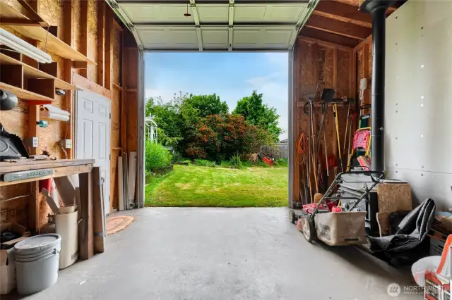 from the back of the shop looking out, there is a wood stove and power for your tools or more lighting or what ever your plans might be.