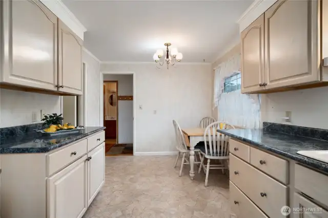 from the direction of the garage door, the walk-in pantry/utility room is to the left, guest bathroom straight ahead and entry just the other side of the wall.