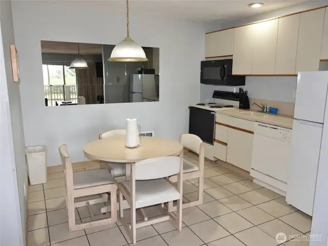 Kitchen/Dining Area w/ tile floors.