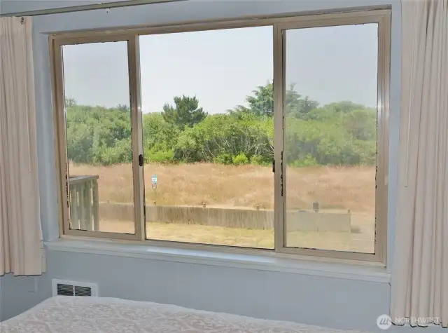 View from the Bedroom ~ looking West towards the backyard and Dunes Area behind the Property.