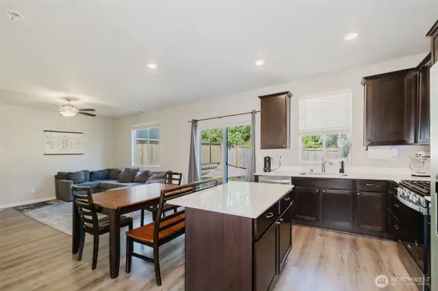 Open-concept kitchen and dining area with ample natural light.