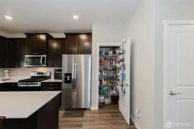 Functional kitchen layout with direct access to dining.