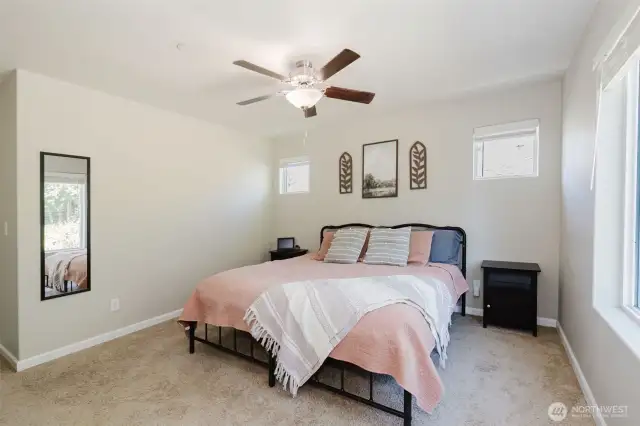 Primary bedroom with walk-in closet access.