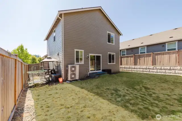 Spacious backyard perfect for play or gardening.