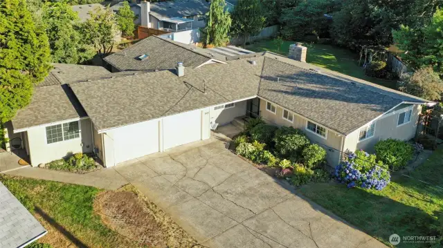 Wonderful single-level living, and a very modest street view that will surprise you once inside!  Attached studio has separate entrace and parking, seen here on left.