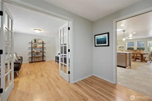 From the entry/den, the kitchen and great room beckon!  Notice the fresh walls and trim--this home has a like-new feel in every room.