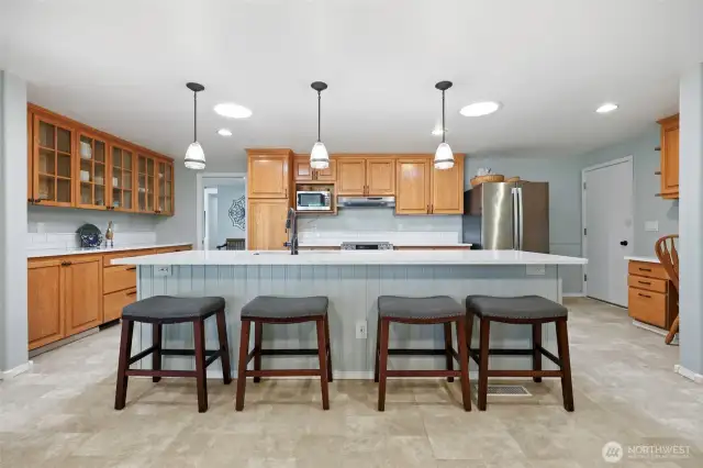 Amazing storage and counter space in the built-in buffet to the left!  Desktop to the right allows for convenient and easy organization. Garage door seen to the right, also
