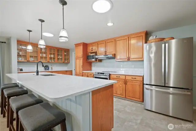 Newer appliances make prepping and cooking a delight.  Lots of room for helpers!