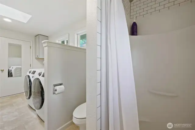 Subway tile surround in the shower, privacy toilet, and door to garage for easy outdoor access. The skylight and several windows bring in the natural light!