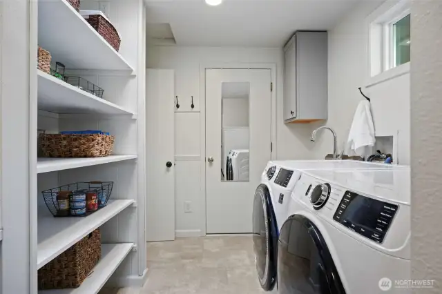 Pantry shelves complement the plentiful storage in the kitchen... nearly too good to be true!