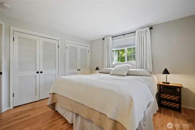 Double closets with classic louvered doors are quite convenient and offer some built-in elements inside.