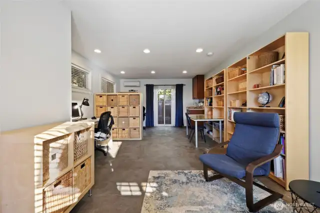 The attached studio was designed as a home office; it is very flexible space and includes the slider to backyard, seen ahead.  The ductless heat pump keeps it warm in winter and cool in summer!