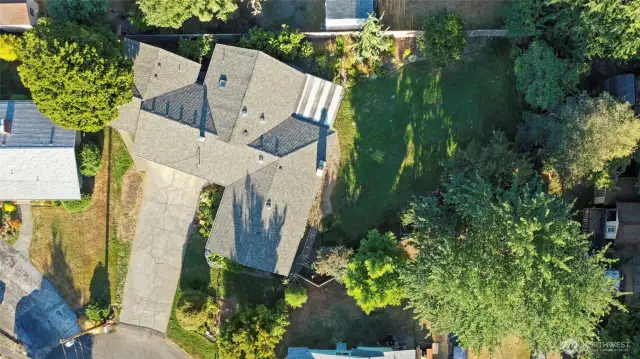 Aerial view shows the layout of the house and yard on the lot; so much private space to appreciate and enjoy!