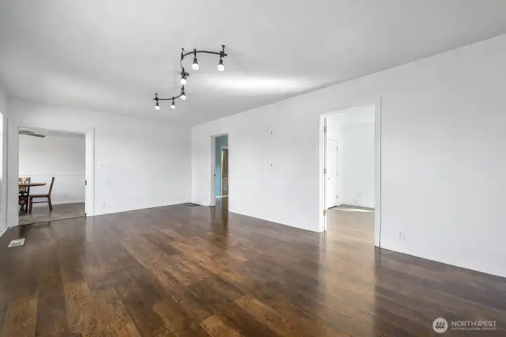 The original front door adds a touch of 1920’s character while opening into a wide, light-filled living room.