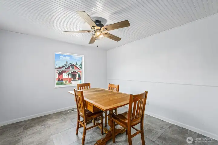 Adjacent to the kitchen, the dining area enjoys natural light and neighborhood views.