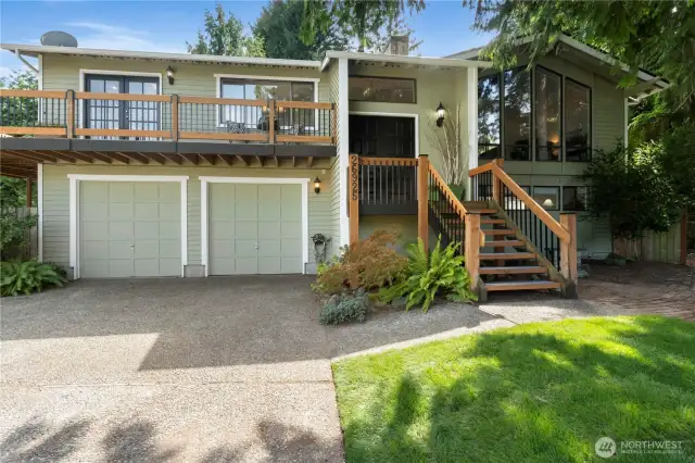 This beautiful Cambridge Split-Level is a stunner from the time you ascend up the front stairs!  This home stands apart from your traditional Split levels, with the different achitechural details such as the wrap-around porch and peaked ceiling with floor to ceiling windows.