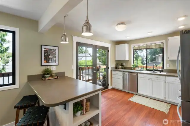 The Island is great place to enjoy breakfast- Solid surface counters and SS Appliances compliment the space.