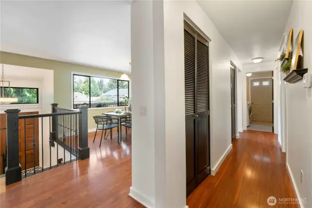 Looking down the hallway, the 2 hall closets offer plenty of storage & there is a vacuum port, with the home offering a Central Vac system.