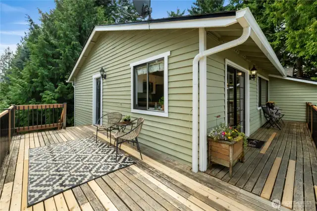 The deck area off of the kitchen- A great place to entertain and enjoy a summer BBQ or meal