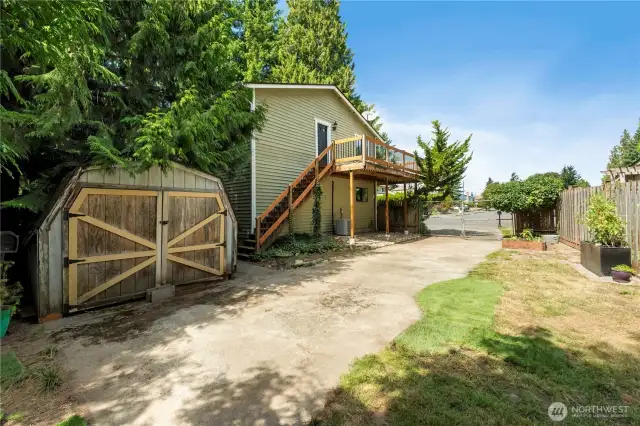 This area is fully fenced, and would be a great space for some raised garden containers or RV or boat storage. this is one of 2 sheds on the property.
