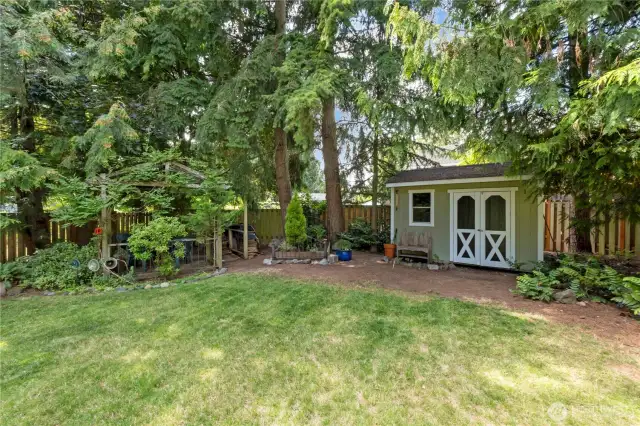 2nd shed, and you'll find a true flower "Bed" and a pergola tucked in the corner where you can enjoy the firepit.