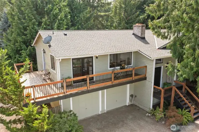 This beautiful home is nestled in the trees, you'll feel the peace & serenity.  Oversized driveway for additional parking if needed.