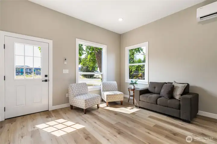 Quaint living area as you enter the home