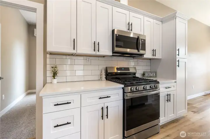 Quartz countertops and white subway tile backsplash