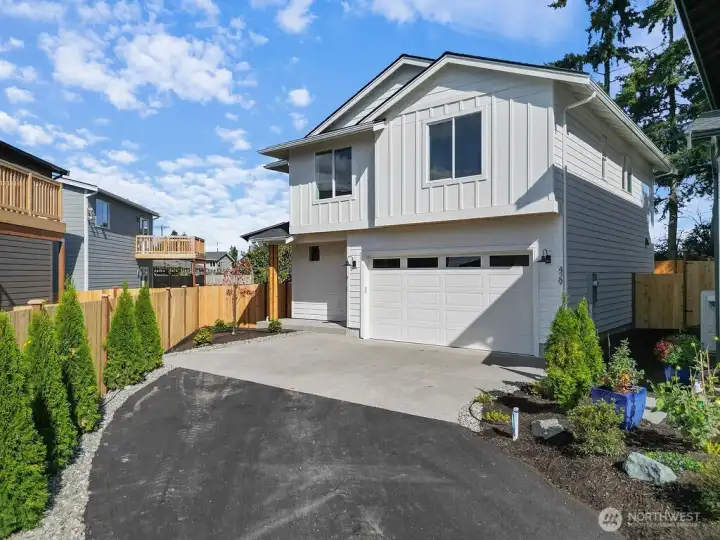 Exterior with Beautifully landscaped entryway.