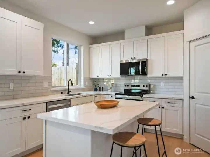 Kitchen is bright and welcoming.