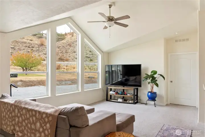 Spacious living room, with huge windows to capture the views.