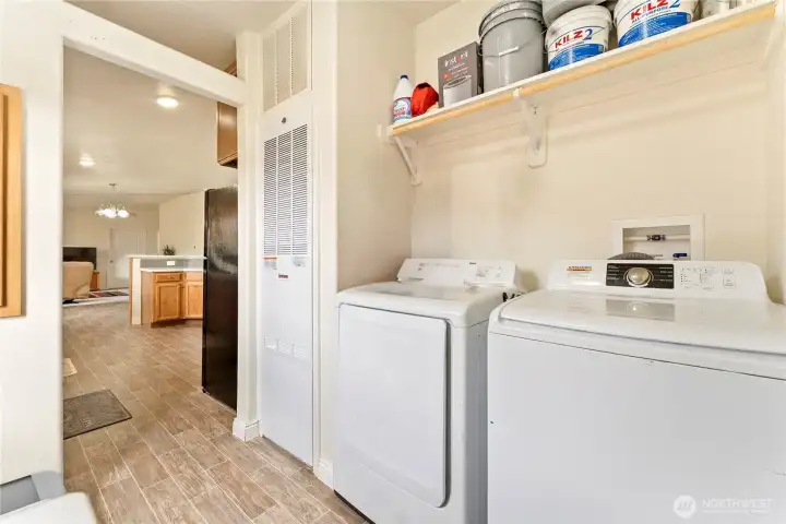 Laundry room off the kitchen, with outdoor access.